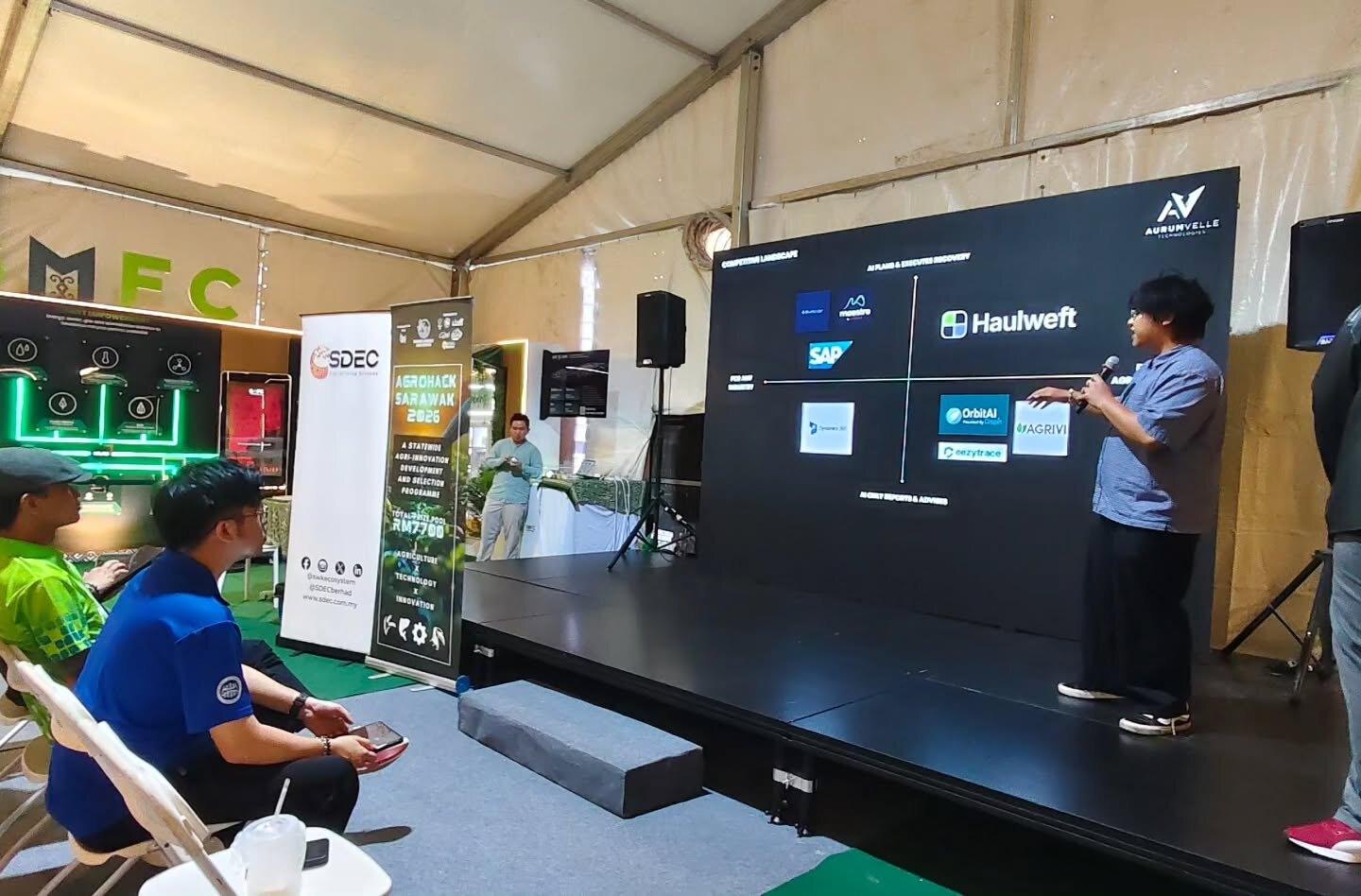 The Haulweft pitch on the AgroHack Sarawak 2026 stage in front of an audience
